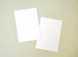 A6 A5 A4 Portrait tent fold mockup. White sheet mockup on green background.