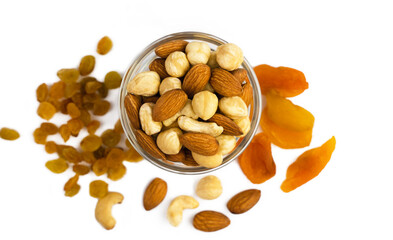 Mix of dried fruits and nuts isolated on white background. Healthy snack. Banner. Close-up. Top view.