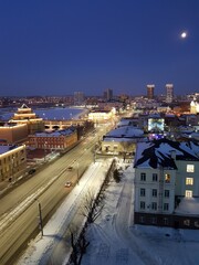 Night city covered with snow