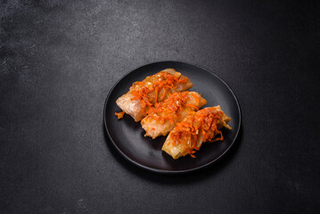 Cabbage rolls stuffed with ground beef and rice in tomato sauce