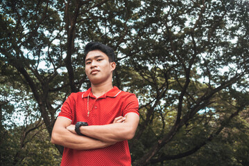 A young serious man in a sarcastic manner. Sardonic about liking a random person in the park.