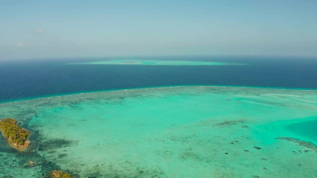 Tropical islands surrounded by an atoll and a coral reef view from above. Balabac, Philippines. Summer and travel vacation concept