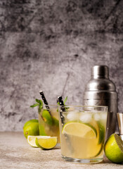 fresh summer caipirinha cocktail on concrete background