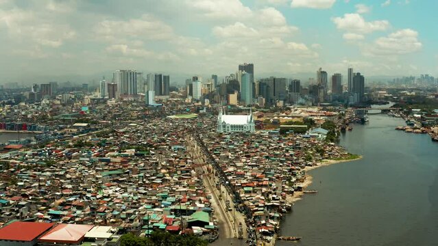 Skyscrapers and business centers in a big city Manila. Modern metropolis in Asia, top view.