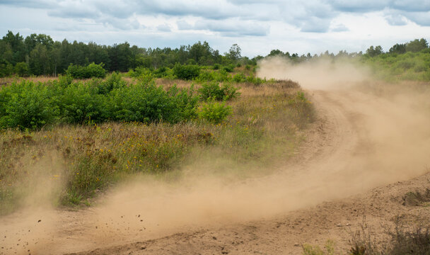 cgi backplate production, dirt road with rising dust after a rally car