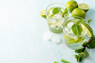 fresh summer caipirinha cocktail on blue background