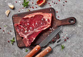 T-bone steak, fork and knife