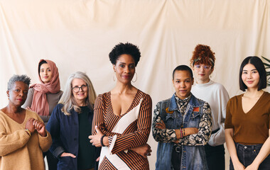 International Women's Day portrait of confident multiethnic mixed age range women looking towards camera