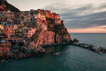 Fototapeta na wymiar view of the town of manarola by the sea in italy at sunset