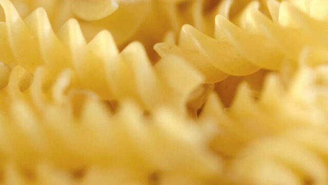 Pasta conchiglie.Pasta for food, rotation. Macaroni - Mini Conchiglie Rigate close up.Shell pasta