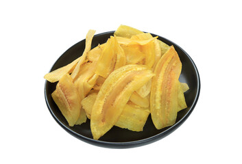 crispy banana slice chips, fried or baked slice banana on black plate with clipping path.