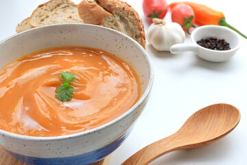 Homemade sweet potato soup served with sour cream in bowl on the table. vegetarian food. 