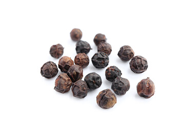 Close up of black pepper corn isolated on white background.
