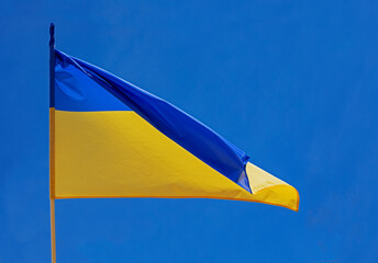 flag of ukraine flutters over the city liberated from the occupier, the war in ukraine