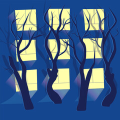 Trees with their shadows against the background of illuminated windows in the house at night