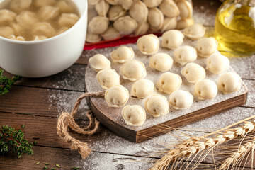 Closeup on semi-finished meat filled russian dumplings