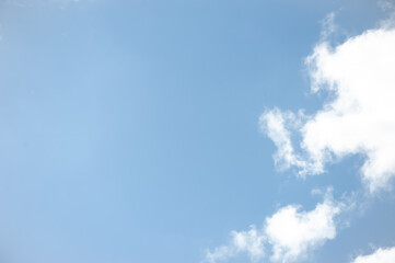 Fototapeta na wymiar Delicate blue sky with white clouds