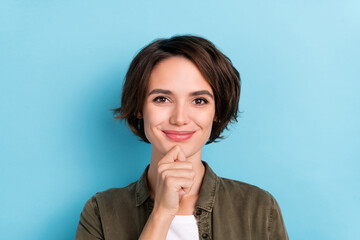 Photo of thinking young brunette lady hand face wear outfit isolated on blue color background