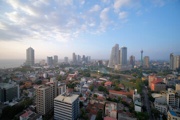Colombo cityscape with view of Beira Lake surrounded by ny large businesses, condos and Lotus Tower