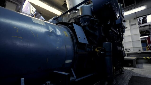 Near diesel generator in engine room of ship