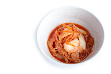 Closeup of Kimchi cabbage in a bowl on a white background. Spicy korean fermented food aged kimchi. korean food style
