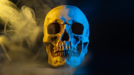 Human skull with yellow and blue lighting and smoke