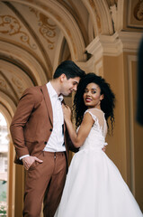 Fototapeta premium Luxurious wedding couple. Clear, even skin. Photo shoot outdoors with natural light. Portrait of a couple in love in wedding attire.