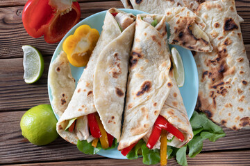 Chicken fajitas. American and mexican cuisine. Fajitas with pepper and chicken