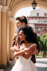 Luxurious wedding couple. Clear, even skin. Photo shoot outdoors with natural light. Portrait of a couple in love in wedding attire.