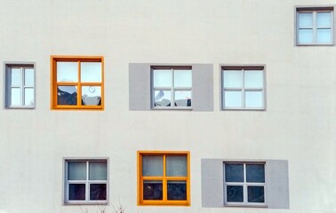 Obraz premium Different windows in size and colors are present on the house