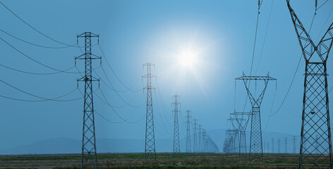 Fototapeta premium High voltage power lines with blue sky