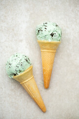 Organic Green Mint Chocolate Chip Ice Cream Scoops in Waffle Cones