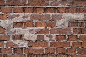 Rote Ziegelsteine / Backsteinwand mit Resten von Putz / Verputzung (Mauer / Textur)