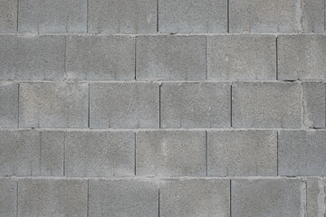 Steinmauer aus grauen Industrie-Steinen (Mauer / Textur)