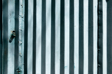 Old metal plating with vertical stripes.