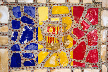 National flag of Andorra on stone  wall background. Flag  banner on  stone texture background.