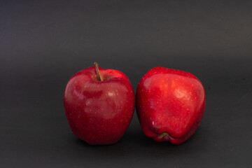 Red apples on a black background
