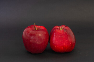 Red apples on a black background