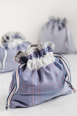Blue linen drawstrings bags on a white background. Eco friendly handmade drawstring bags.
