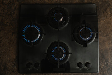 Gas burners on the stove. blue flames, view from above