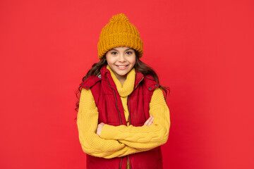 portrait of child wearing warm clothes. express positive emotion. winter fashion.
