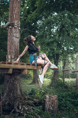 Naklejka na ściany i meble beautiful young girl in short shorts and a T-shirt smeared with swamp holds a dagger