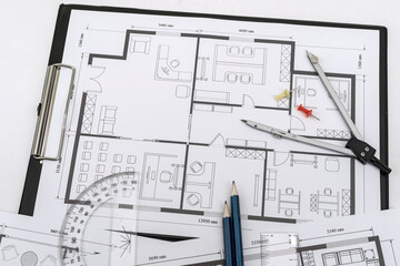 Naklejka na ściany i meble drawing house plan with drawing instruments