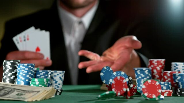 Super slow motion of poker player throwing chip towards camera. Filmed on high speed cinema camera, 1000fps. Speed ramp effect.