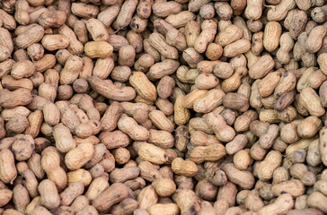 A heap of brown nuts close up shot with selective focus