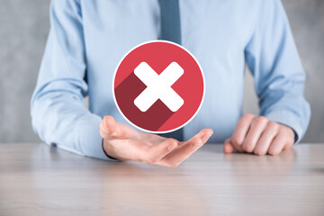Hand holds icon,cancellation symbol,cancel icon.Cross mark flat red icon.round X mark.cancel...