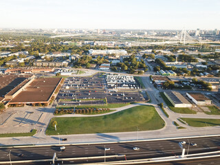 Business park and industrial zone along I-30 Tom Landry Freeway west of downtown Dallas with Margaret Hunt Hill Bridge in background