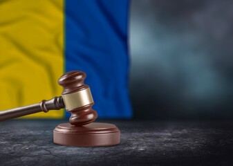 Judge's law gavel with flag of Ukraine on desk