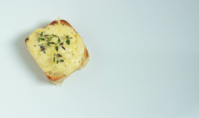 Toast Croc Monsieur with a sprig of thyme. Top view