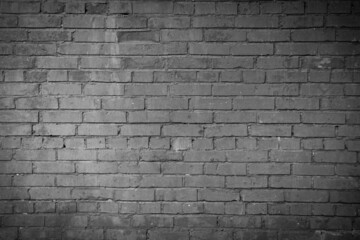 Old vintage dark gray brick wall for brick background or texture
